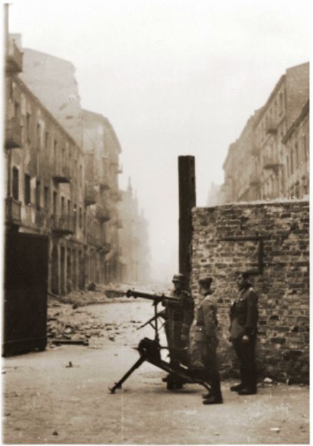 German police and an SS soldier man a machine-gun during the suppression of the Warsaw ghetto